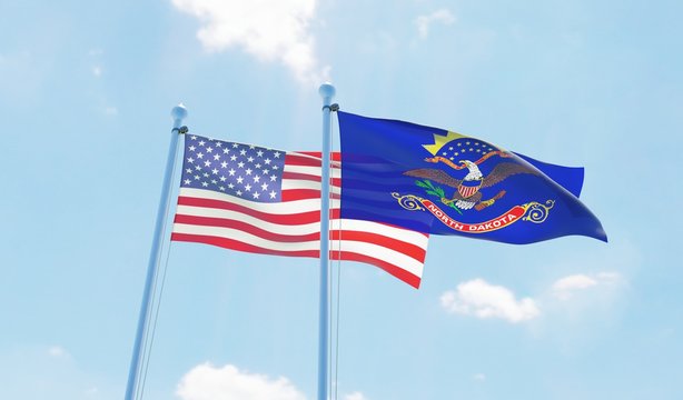 USA and state North Dakota, two flags waving against blue sky. 3d image