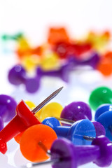Close up of colourful push pins
