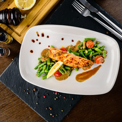 salmon fillet with vegetables in a restaurant