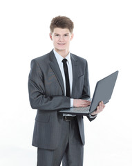 confident young businessman with a laptop .isolated on a white