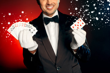 Professional Occupation. Showman in suit and gloves standing isolated on wall smiling cheerful...