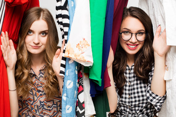Young beautiful women at the weekly cloth market - Best friends sharing free time having fun and...