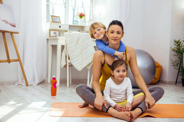 Delighted positive woman being with her children