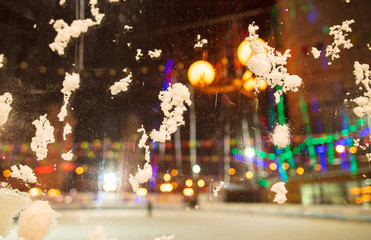 Snow on the glass at night as a background