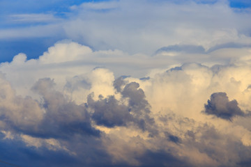 Clouds after rain before sunset as a background