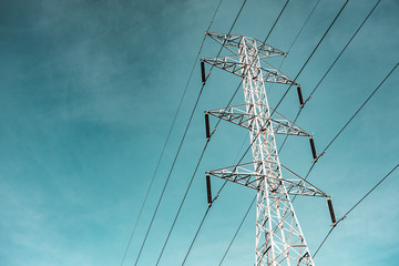 High voltage electricity pylon for electric supply transmission with blue sky, Power distribution...