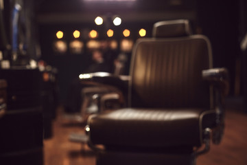 Brown leather chair in barbershop. Loft style