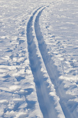 Fototapeta na wymiar Cross-country skiing tracks in fresh snow, sunny winter day, in Finland.