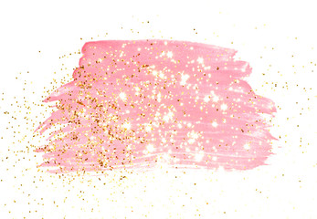 Golden glitter on abstract pink watercolor splash on white background