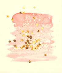 Fototapeta na wymiar Golden glitter and glittering stars on abstract pink watercolor splash in vintage nostalgic colors.