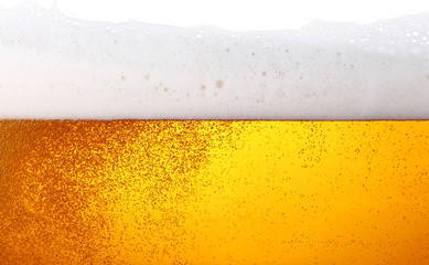 Close up background of beer with bubbles in glass