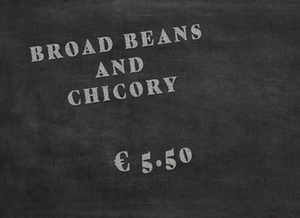 Offer of a meal broad beans and chicory for an amount of 5.50 euros. White words on a black chalkboard
