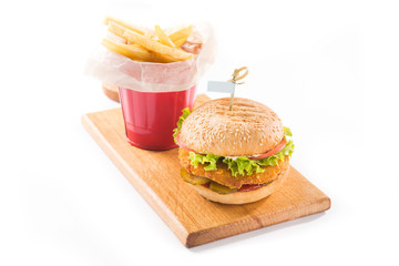 hamburger and french fries on a wooden board