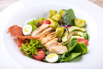Fresh salad with fillet, avocado, tomato
