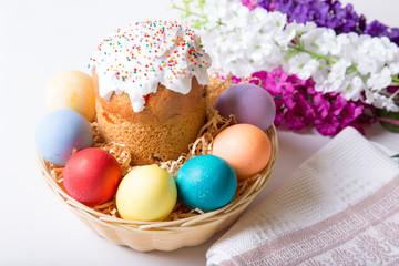 Fototapeta premium Easter. Traditional Russian and Ukrainian Easter cake (kulich) and painted eggs. Close-up, selective focus.