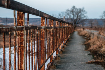 Rusty handrail of the bridge