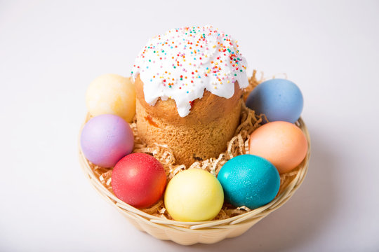 Easter. Traditional Russian and Ukrainian Easter cake (kulich) and painted eggs. Close-up, selective focus.