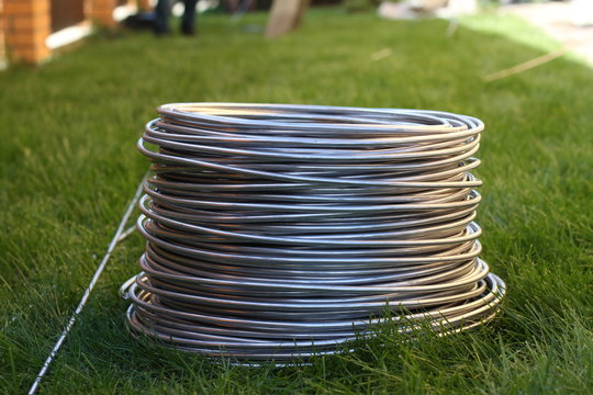 Aluminum wire coil on the grass