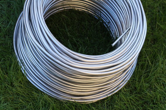 Aluminum wire coil on the grass