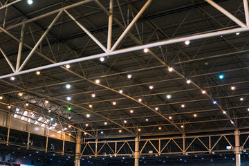 Interior of warehouse. large metal structures, ceiling. roof. concept production and installation of equipment for rooms, lighting, ventilation and windows for hangars