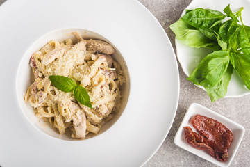 tasty italian pasta with basil and cheese