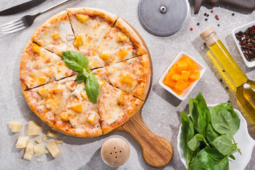 Hot pizza with chicken fillet and peach