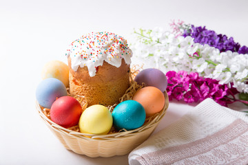 Fototapeta na wymiar Easter. Traditional Russian and Ukrainian Easter cake (kulich) and painted eggs. Close-up, selective focus.