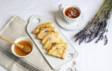 Homemade Pancakes with Honey, Tea, Lavender Flowers, Easy Food Concept Breakfast 
