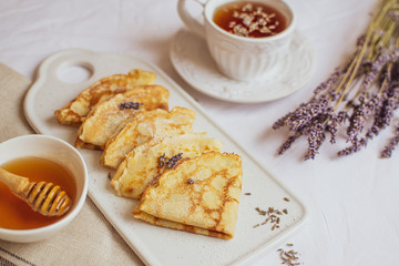 Homemade Pancakes with Honey, Tea, Lavender Flowers, Easy Food Concept Breakfast 