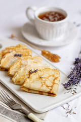 Homemade Pancakes with Honey, Tea, Lavender Flowers, Easy Food Concept Breakfast 