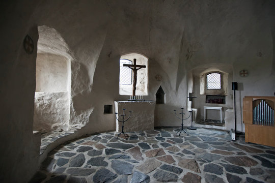 hall with a crucifix in the castle15th-century Olavinlinna (Olofsborg), in Savonlinna, Finland..