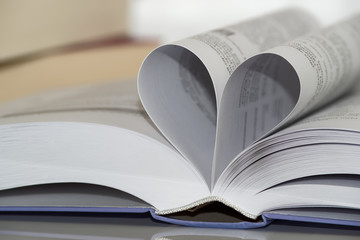 Close-up of heart shape from paper book