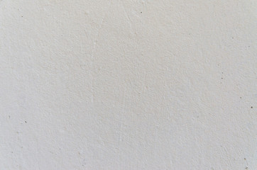 The texture of the old wall with scratches and cracks.