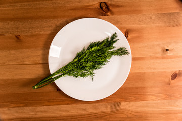 bowl of herbs and spices on wooden table