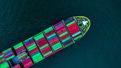 Fototapeta na wymiar Container ship carrying container for import and export, Aerial view business logistic and freight transportation by ship in open sea.