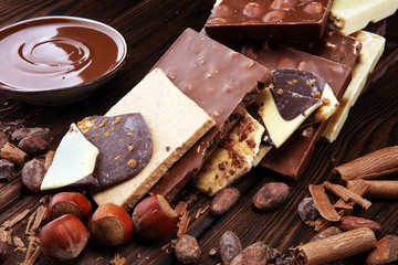 Chocolate bars on table with chocolate tower.