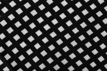 Fragment of black and white fabric. Plaid cotton fabric background