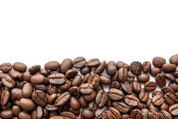 Roasted coffee beans on white background. Close-up.