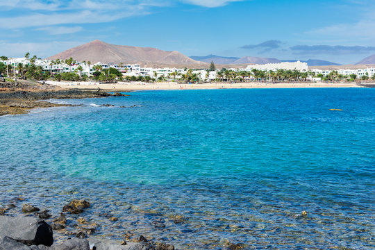 View of Playa de las Cucharas beach in Costa Teguise, Lanzarote, Spain, turquoise waters, selective focus