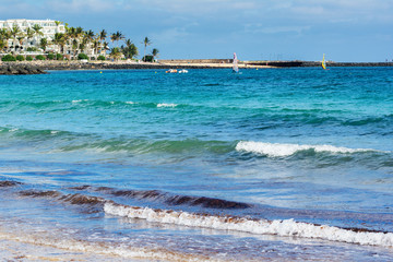 View of Playa de las Cucharas beach in Costa Teguise, Lanzarote, Spain, clear turquoise waters, selective focus