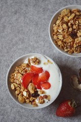 Homemade Granola Yogurt bowl with fresh strawberries