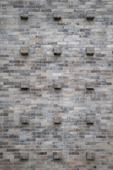 Fototapeta premium Cube brick stone block on the wall with the tile and seamless pattern.