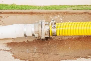 Fototapeta premium yellow water pipe with the water leakage.