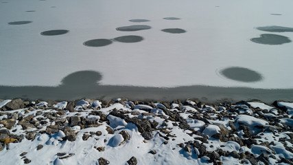 creative shapes on frozen lake and ice