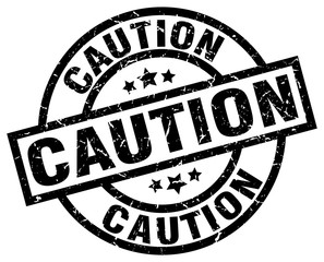 caution round grunge black stamp