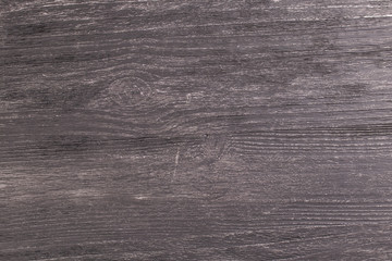 Obraz premium Texture of old dark wooden table in the rays of light