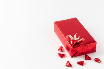 Red gift box for Valentine's Day or various festivals and red hearts that folded from paper Arrange the elements in the lower right corner.