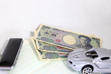 車と現金と通帳(白背景）