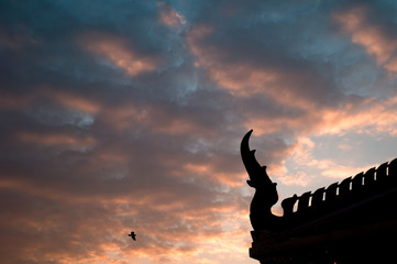 Thai house silhouette and beautiful sunset. sky of heaven