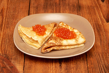 Russian pancakes with red caviar